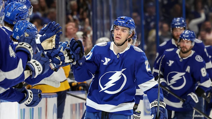 Tampa Bay Lightning forward, Brayden Point, fist bumping the bench after scoring against the Nashville Predators