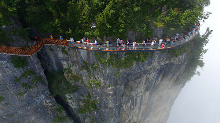 Glass Skywalk Overlooking Road Of 99 Turns 0pens In Zhangjiajie