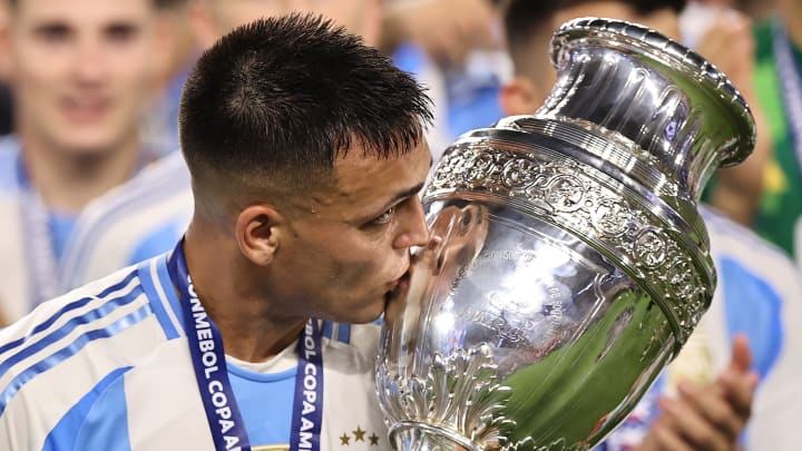 Lautaro Martinez with the Copa America trophy after scoring the game-winning goal against Colombia