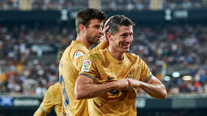 Gerard Piqué y Lewandowski en la celebración de un gol con el Barcelona