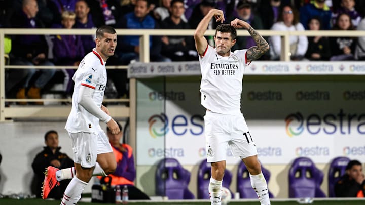 Christian Pulisic of AC Milan celebrates with Alvaro Morata...
