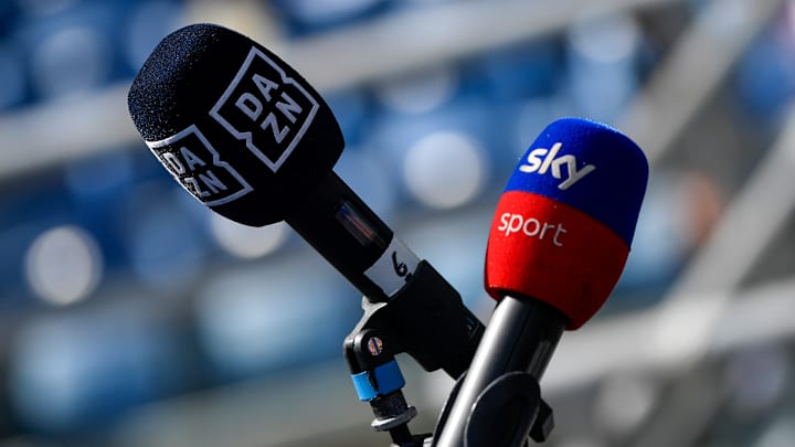 A couple of microphones branded DAZN and Sky Sport are seen...