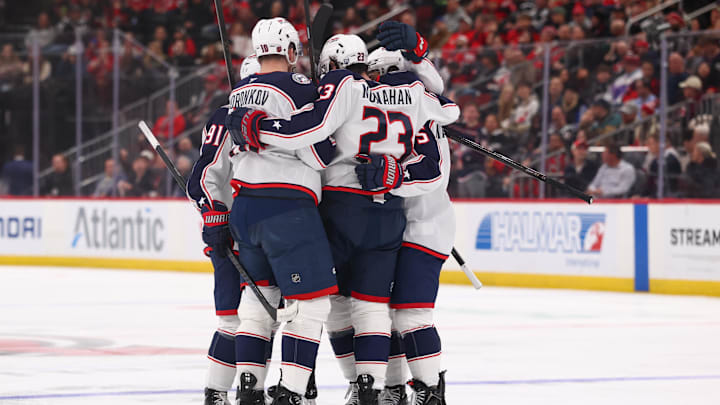 The Blue Jackets celebrate a goal against the New Jersey Devils.