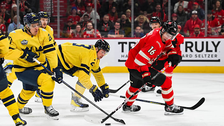 Feb 12, 2025; Montreal, Quebec, CAN; [Imagn Images direct customers only] Team Canada forward Mitch Marner (16) plays the puck as Team Sweden forward Joel Eriksson (20) defends in the first period during a 4 Nations Face-Off ice hockey game at Bell Centre. Mandatory Credit: David Kirouac-Imagn Images