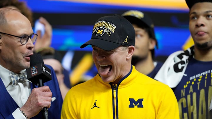 Michigan Wolverines head coach Dusty May celebrates the team’s NCAA men's basketball tournament national championship victory Monday, April 6, 2026, after defeating the UConn Huskies 69-63 at Lucas Oil Stadium in Indianapolis. Michigan Wolverines head coach Dusty May celebrates the team’s NCAA men's basketball tournament national championship victory Monday, April 6, 2026, after defeating the UConn Huskies 69-63 at Lucas Oil Stadium in Indianapolis.