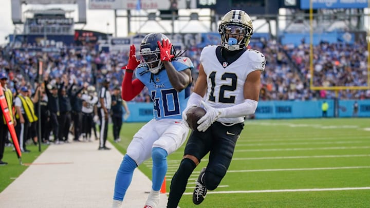 Tennessee Titans cornerback Kemon Hall, New Orleans Saints wide receiver Chris Olave (12) Tennessee Titans cornerback Kemon Hall, New Orleans Saints wide receiver Chris Olave (12)
