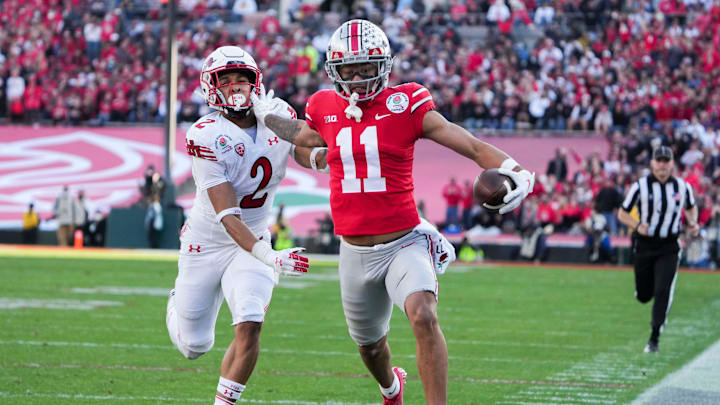 Ohio State wide receiver Jaxon Smith-Njigba fends off Utah cornerback Micah Bernard as he races to the end zone for a touchdown during the second quarter of the 2022 Rose Bowl in Pasadena, Calif.

2022-08-23-smith-njigba