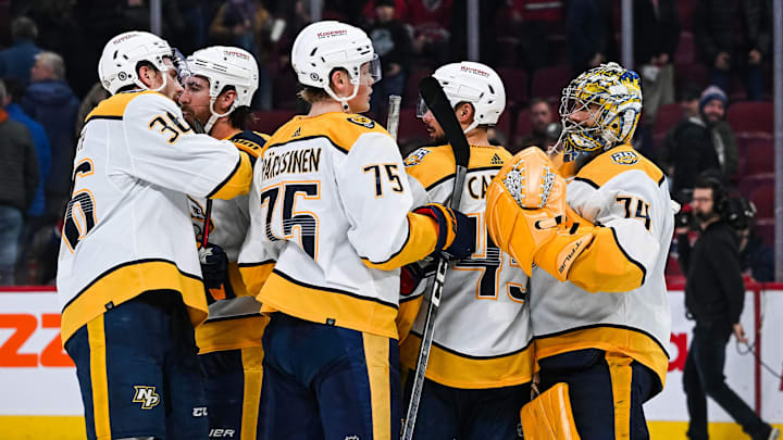 Dec 10, 2023; Montreal, Quebec, CAN; Nashville Predators players gather around goalie Juuse Saros