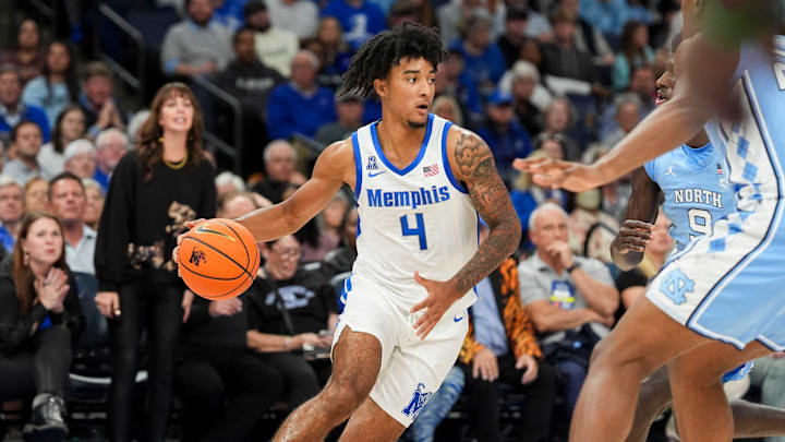 Memphis' PJ Haggerty (4) dribbles the ball during the game between UNC and Memphis in the Hoops for St. Jude Tip Off Classic at FedExForum on Tuesday, October 15, 2024.