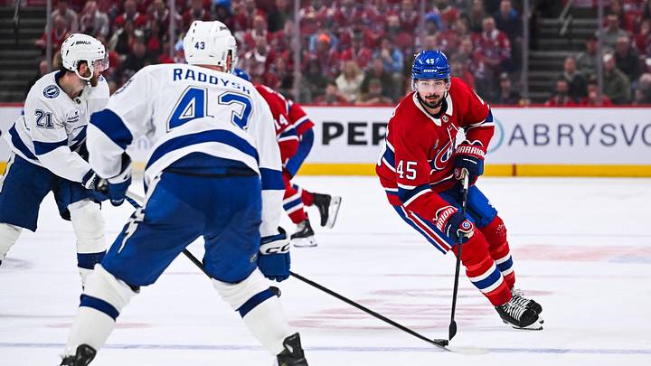 Apr 26, 2026; Montreal, Quebec, CAN; Montreal Canadiens defenseman Alexandre Carrier (45) plays the puck against Tampa Bay Lightning defenseman Darren Raddysh (43) during the third period in game four of the first round of the 2026 Stanley Cup Playoffs at Bell Centre. Mandatory Credit: David Kirouac-Imagn Images