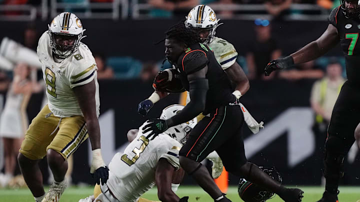 Oct 7, 2023; Miami Gardens, Florida, USA; Miami Hurricanes running back Donald Chaney Jr. (2) runs the ball against the Georgia Tech Yellow Jackets in the second half at Hard Rock Stadium. Mandatory Credit: Jasen Vinlove-Imagn Images