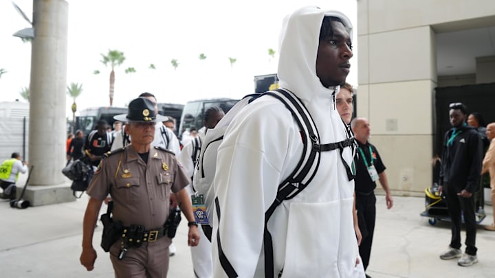 Dec 28, 2024; Orlando, FL, USA; Miami Hurricanes quarterback Cam Ward (1) arrives prior to the game against the Iowa State Cyclones at Camping World Stadium. Mandatory Credit: Jasen Vinlove-Imagn Images