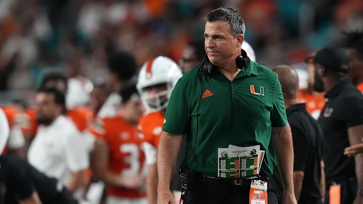 Nov 26, 2022; Miami Gardens, Florida, USA; Miami Hurricanes head coach Mario Cristobal stands on the sideline during the first half against the Pittsburgh Panthers at Hard Rock Stadium. Mandatory Credit: Jasen Vinlove-Imagn Images