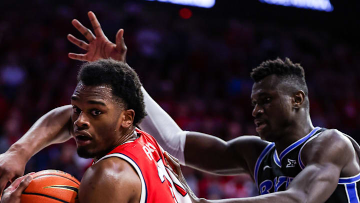 Feb 22, 2025; Tucson, Arizona, USA; Arizona Wildcats forward Tobe Awaka (30) looks to pass the ball while BYU Cougars center Keba Keita (13) is ready to block him during the second half at McKale Center. Mandatory Credit: Aryanna Frank-Imagn Images