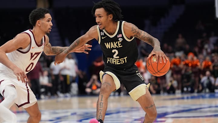 Mar 10, 2026; Charlotte, NC, USA; Wake Forest Demon Deacons forward Juke Harris (2) dribbles the ball against Virginia Tech Hokies guard Jailen Bedford (0) during the second half at Spectrum Center. Mandatory Credit: Jim Dedmon-Imagn Images