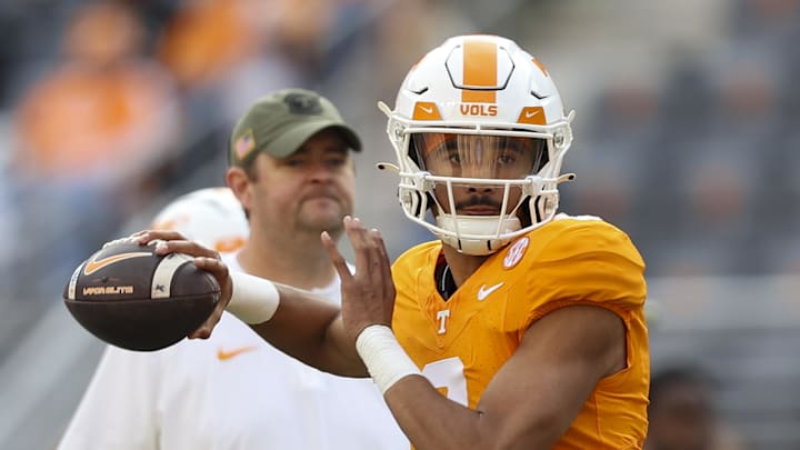 Nov 25, 2023; Knoxville, Tennessee, USA; Tennessee Volunteers quarterback Nico Iamaleava (8) warms up as head coach Josh Heupel looks on before the game against the Vanderbilt Commodores at Neyland Stadium. Mandatory Credit: Randy Sartin-Imagn Images