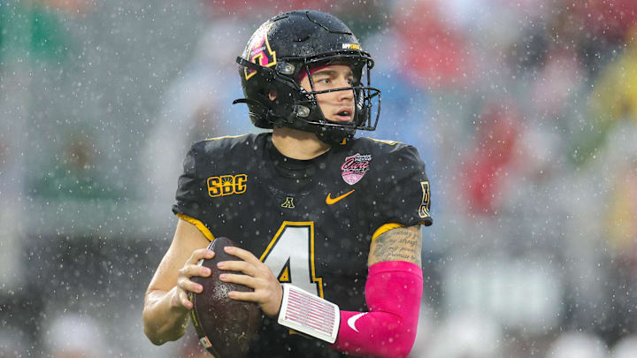 Dec 16, 2023; Orlando, FL, USA;  Appalachian State Mountaineers quarterback Joey Aguilar (4) drops back to pass against the Miami (OH) Redhawks in the first quarter during the Avocados from Mexico Cure Bowl at FBC Mortgage Stadium. Mandatory Credit: Nathan Ray Seebeck-Imagn Images