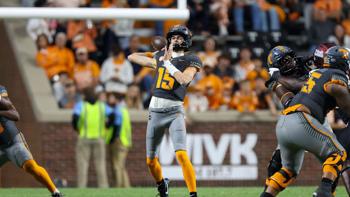Nov 15, 2025; Knoxville, Tennessee, USA;  Tennessee Volunteers quarterback George MacIntyre (15) passes the ball against the New Mexico State Aggies during the second half at Neyland Stadium. Mandatory Credit: Randy Sartin-Imagn Images