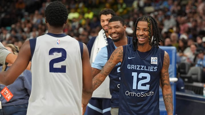 Grizzlies' Miye Oni (2) is congratulated by Marcus Smart (36) and Ja Morant (12) after winning a round of knockout during open practice at FedExForum in Memphis, Tenn., on Sunday, October 6, 2024.