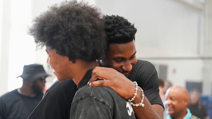 Grizzlies players Jaylen Wells and Jaren Jackson Jr. hug during the Jaren Jackson Jr. Youth Basketball Camp at the Memphis Sports & Events Center on September 13, 2025.