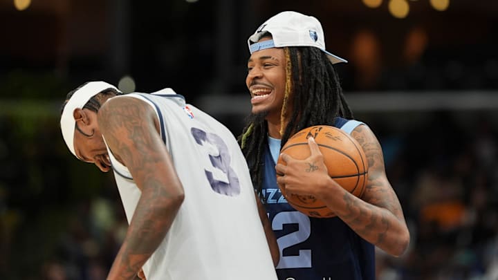Grizzlies' Ja Morant (12) and Kentavious Caldwell-Pope (3) laugh together during open practice at the FedExForum on October 4, 2025, in Memphis, Tenn.