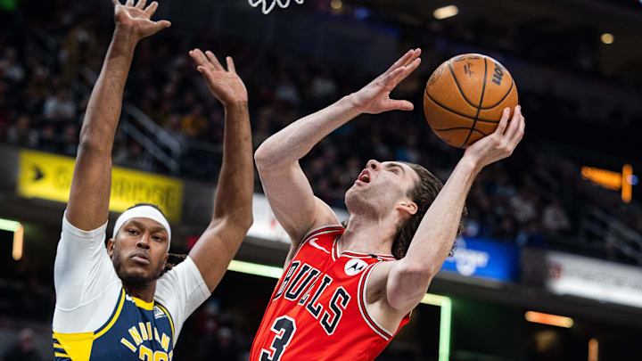 Mar 2, 2025; Indianapolis, Indiana, USA; Chicago Bulls guard Josh Giddey (3)  shoots the ball while Indiana Pacers center Myles Turner (33) defends in the first half at Gainbridge Fieldhouse. Mandatory Credit: Trevor Ruszkowski-Imagn Images