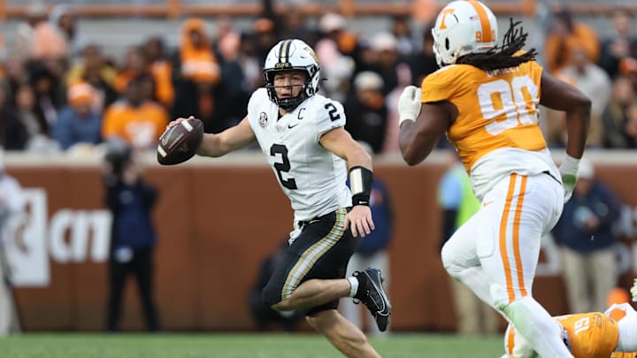 Nov 29, 2025; Knoxville, Tennessee, USA;  Vanderbilt Commodores quarterback Diego Pavia (2) scrambles with against the Tennessee Volunteers during the first half at Neyland Stadium. Mandatory Credit: Randy Sartin-Imagn Images