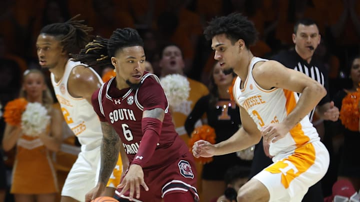 Mar 8, 2025; Knoxville, Tennessee, USA; South Carolina Gamecocks guard Jamarii Thomas (6) moves the ball against Tennessee Volunteers guard Bishop Boswell (3) during the first half at Thompson-Boling Arena at Food City Center. Mandatory Credit: Randy Sartin-Imagn Images