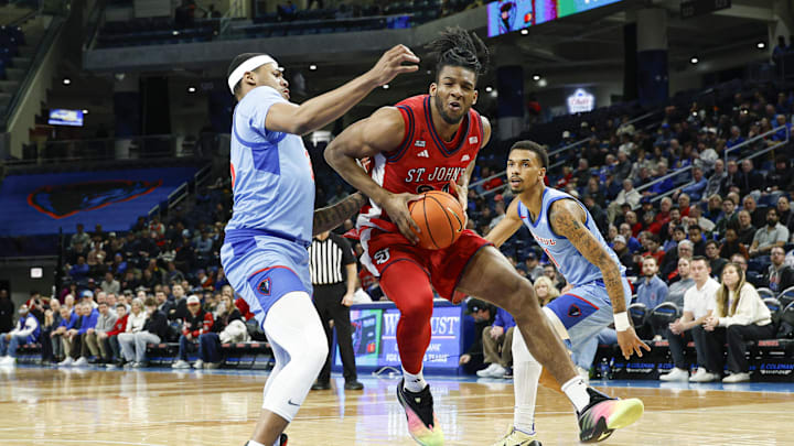 Feb 3, 2026; Chicago, Illinois, USA; St. John's basketball forward Zuby Ejiofor (24) drives to the basket against the DePaul Blue Demons during the first half at Wintrust Arena.