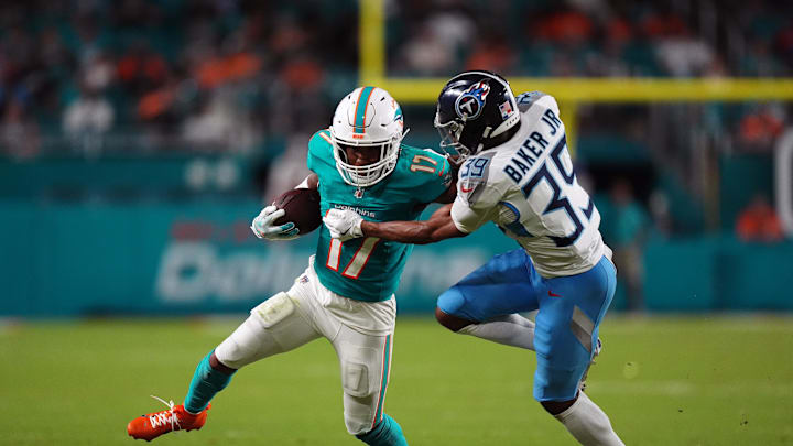 Sep 30, 2024; Miami Gardens, Florida, USA; Tennessee Titans cornerback Darrell Baker Jr. (39) attempts to bring down Miami Dolphins wide receiver Jaylen Waddle (17) during the second half at Hard Rock Stadium. Mandatory Credit: Jasen Vinlove-Imagn Images