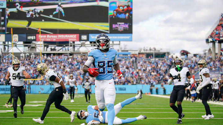 Dec 28, 2025; Nashville, Tennessee, USA; Tennessee Titans tight end Chig Okonkwo (85) makes it to the end zone during the second quarter against the New Orleans Saints at Nissan Stadium. Mandatory Credit: Andrew Nelles-USA TODAY Network via Imagn Images