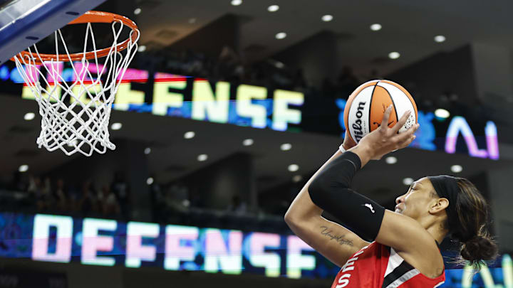 Aug 25, 2024; Chicago, Illinois, USA; Las Vegas Aces center A'ja Wilson (22) shoots and scores game winning basket against the Chicago Sky during the second half at Wintrust Arena. Mandatory Credit: Kamil Krzaczynski-Imagn Images