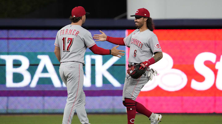 Cincinnati Reds shortstop Kyle Farmer (17) celebrates with Jonathan India
