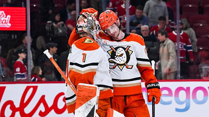 Mar 15, 2026; Montreal, Quebec, CAN; Anaheim Ducks defenseman Jacob Trouba (65) celebrates with goalie Lukas Dostal (1) the win against the Montreal Canadiens after the third period at Bell Centre. Mandatory Credit: David Kirouac-Imagn Images