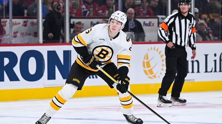 Mar 17, 2026; Montreal, Quebec, CAN; Boston Bruins defenseman Mason Lohrei (6) plays the puck against the Montreal Canadiens during the first period at Bell Centre. Mandatory Credit: David Kirouac-Imagn Images