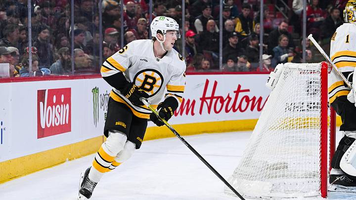 Mar 17, 2026; Montreal, Quebec, CAN; Boston Bruins defenseman Mason Lohrei (6) plays the puck against the Montreal Canadiens during the second period at Bell Centre. Mandatory Credit: David Kirouac-Imagn Images