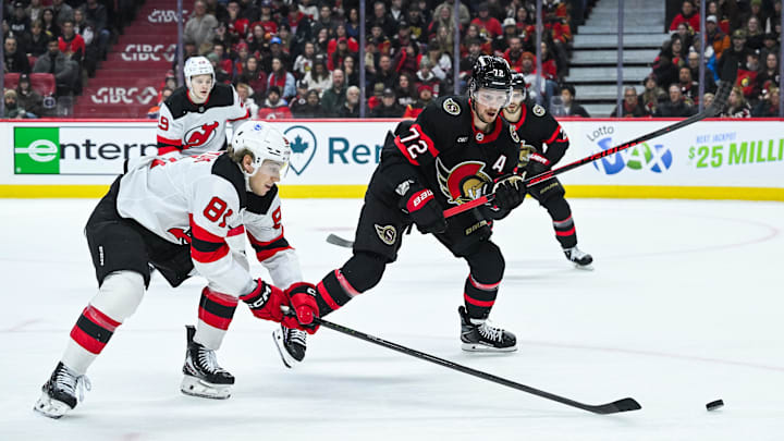 Jan 31, 2026; Ottawa, Ontario, CAN; New Jersey Devils right wing Arseny Gritsyuk (81) reaches put for the puck against Ottawa Senators defenseman Thomas Chabot (72) during the second period at Canadian Tire Centre. Mandatory Credit: David Kirouac-Imagn Images Jan 31, 2026; Ottawa, Ontario, CAN; New Jersey Devils right wing Arseny Gritsyuk (81) reaches put for the puck against Ottawa Senators defenseman Thomas Chabot (72) during the second period at Canadian Tire Centre. Mandatory Credit: David Kirouac-Imagn Images