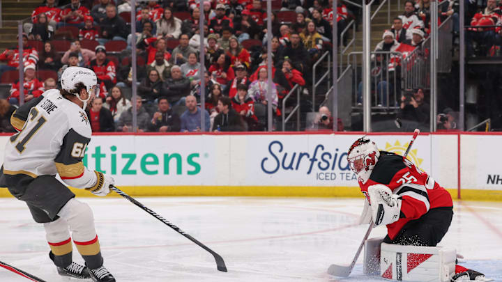 Vegas Golden Knights right wing Mark Stone (61) shoots the puck on New Jersey Devils goaltender Jacob Markstrom (25): Ed Mulholland-Imagn Images