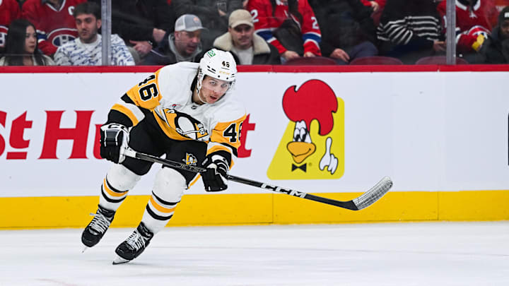 Dec 12, 2024; Montreal, Quebec, CAN; Pittsburgh Penguins center Blake Lizotte (46) passes the puck against the Montreal Canadiens during the second period at Bell Centre. Mandatory Credit: David Kirouac-Imagn Images