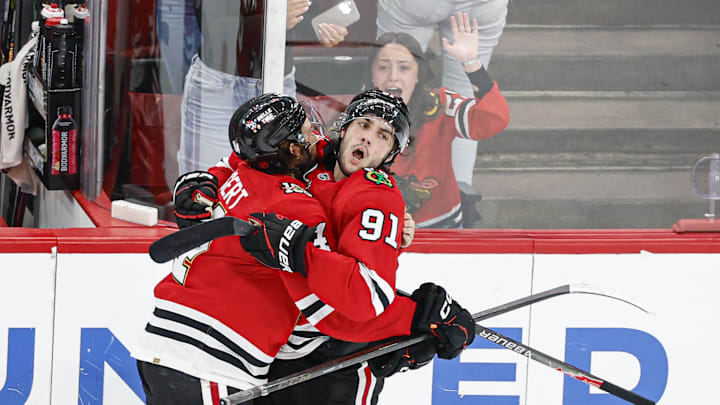 Mar 9, 2026; Chicago, Illinois, USA; Chicago Blackhawks center Frank Nazar (91) celebrates with left wing Landon Slaggert (84) after scoring a game winning goal against the Utah Mammoth in overtime at United Center. Mandatory Credit: Kamil Krzaczynski-Imagn Images