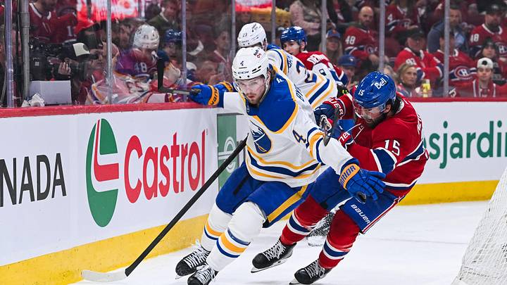 May 16, 2026; Montreal, Quebec, CAN; Buffalo Sabres defenseman Bowen Byram (4) defends the puck against Montreal Canadiens center Alex Newhook (15) during the third period in game six of the second round of the 2026 Stanley Cup Playoffs at Bell Centre. Mandatory Credit: David Kirouac-Imagn Images