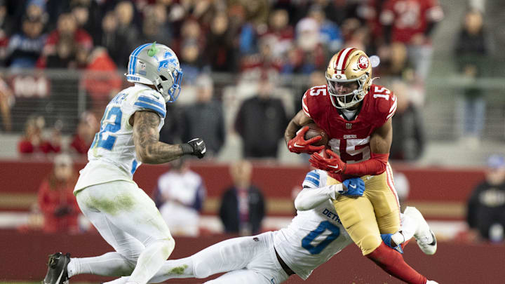 December 30, 2024; Santa Clara, California, USA; San Francisco 49ers wide receiver Jauan Jennings (15) is tackled by Detroit Lions cornerback Terrion Arnold (0) during the fourth quarter at Levi's Stadium. Mandatory Credit: Kyle Terada-Imagn Images