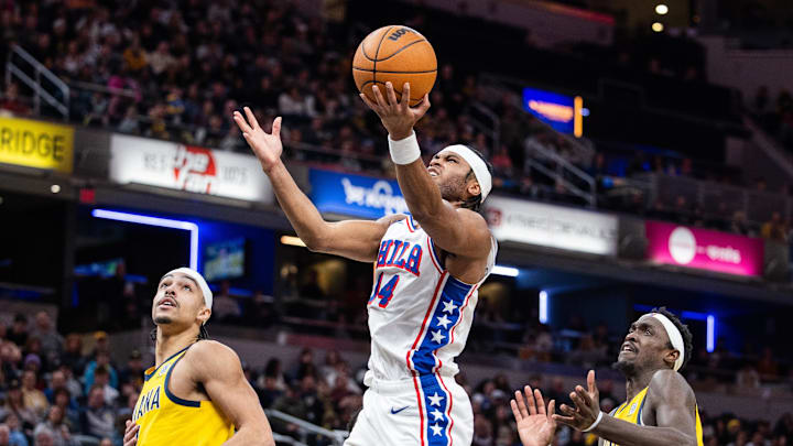 Jan 18, 2025; Indianapolis, Indiana, USA; Philadelphia 76ers guard Ricky Council IV (14) shoots the ball while Indiana Pacers guard Andrew Nembhard (2) and forward Pascal Siakam (43) defend in the second half at Gainbridge Fieldhouse. Mandatory Credit: Trevor Ruszkowski-Imagn Images
