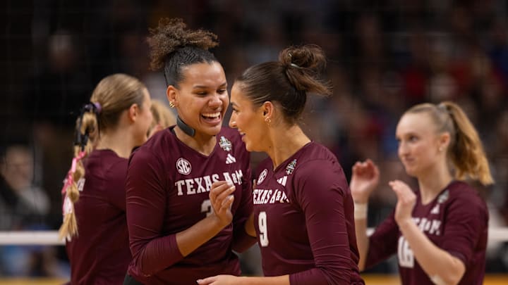 Dec 18, 2025; Kansas City, MO, USA; Texas A&M Aggies outside hitter Kyndal Stowers (37) and opposite hitter Logan Lednicky (9) celebrate during the second set in a 2025 NCAA Women’s Volleyball Championship semifinal match at T-Mobile Center. Mandatory Credit: Kylie Graham-Imagn Images