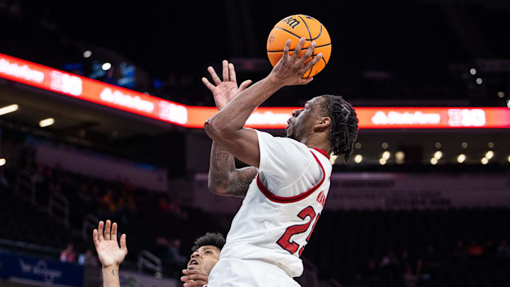 Mar 12, 2025; Indianapolis, IN, USA; Rutgers Scarlet Knights center Lathan Sommerville (24) shoots the ball while USC Trojans guard Chibuzo Agbo (7) defends in the second half at Gainbridge Fieldhouse. Mandatory Credit: Trevor Ruszkowski-Imagn Images Mar 12, 2025; Indianapolis, IN, USA; Rutgers Scarlet Knights center Lathan Sommerville (24) shoots the ball while USC Trojans guard Chibuzo Agbo (7) defends in the second half at Gainbridge Fieldhouse. Mandatory Credit: Trevor Ruszkowski-Imagn Images