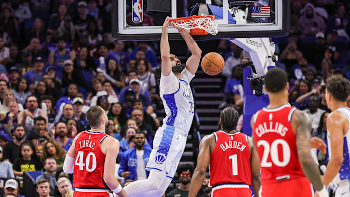 Nov 20, 2025; Orlando, Florida, USA; Orlando Magic center Goga Bitadze (35) dunks during the second half against the LA Clippers at Kia Center. Mandatory Credit: Mike Watters-Imagn Images