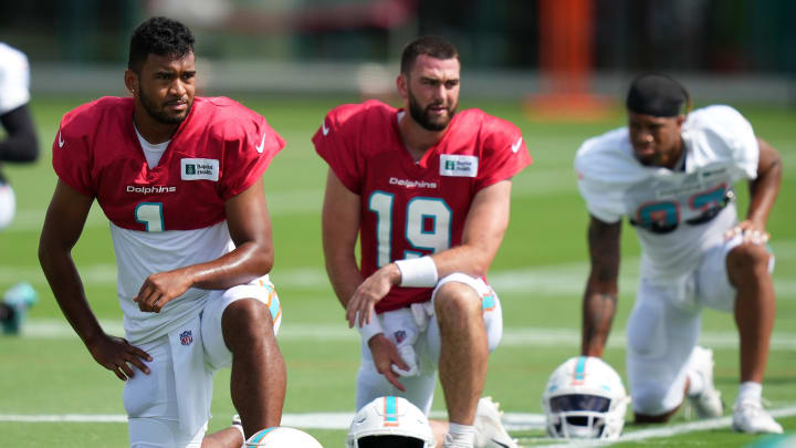Aug 2, 2022; Miami Gardens, Florida, US; Miami Dolphins quarterback Tua Tagovailoa (1) and quarterback Skylar Thompson (19) stretch during training camp at Baptist Health Training Complex. Aug 2, 2022; Miami Gardens, Florida, US; Miami Dolphins quarterback Tua Tagovailoa (1) and quarterback Skylar Thompson (19) stretch during training camp at Baptist Health Training Complex.