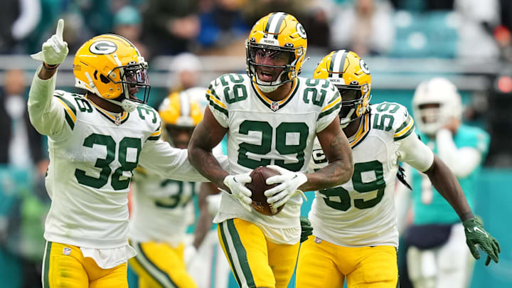 Green Bay Packers cornerback Rasul Douglas (29) celebrates with teammates after intercepting a pass from Miami Dolphins quarterback Tua Tagovailoa (not pictured) during the second half at Hard Rock Stadium on Christmas Day 2022. Green Bay Packers cornerback Rasul Douglas (29) celebrates with teammates after intercepting a pass from Miami Dolphins quarterback Tua Tagovailoa (not pictured) during the second half at Hard Rock Stadium on Christmas Day 2022.