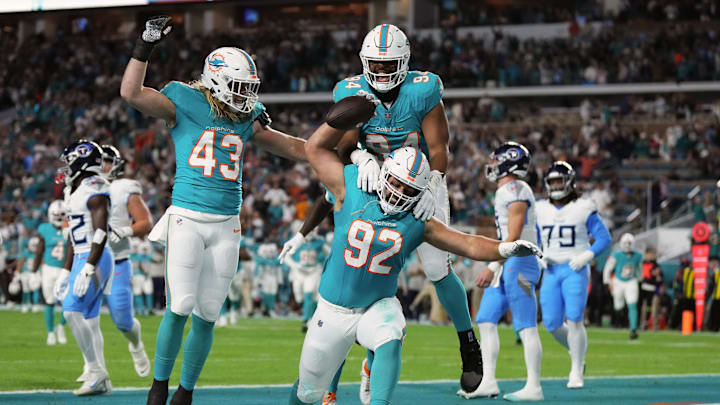 Miami Dolphins defensive tackle Zach Sieler (92) celebrates his touchdown after intercepting a pass from Tennessee Titans quarterback Will Levis during the first half at Hard Rock Stadium in 2023. Miami Dolphins defensive tackle Zach Sieler (92) celebrates his touchdown after intercepting a pass from Tennessee Titans quarterback Will Levis during the first half at Hard Rock Stadium in 2023.