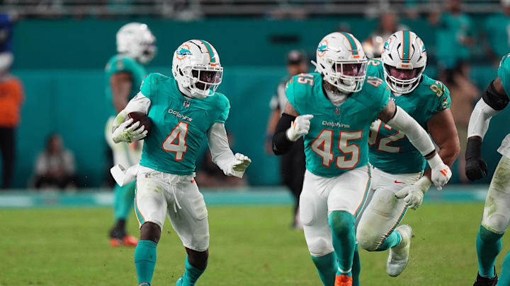 Dec 22, 2024; Miami Gardens, Florida, USA; Miami Dolphins cornerback Kader Kohou (4) runs with the ball after intercepting a pass from San Francisco 49ers quarterback Brock Purdy during second half at Hard Rock Stadium. Mandatory Credit: Jasen Vinlove-Imagn Images